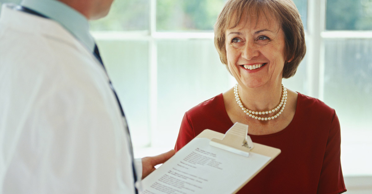 Patient speaking to her doctor about her medical records.